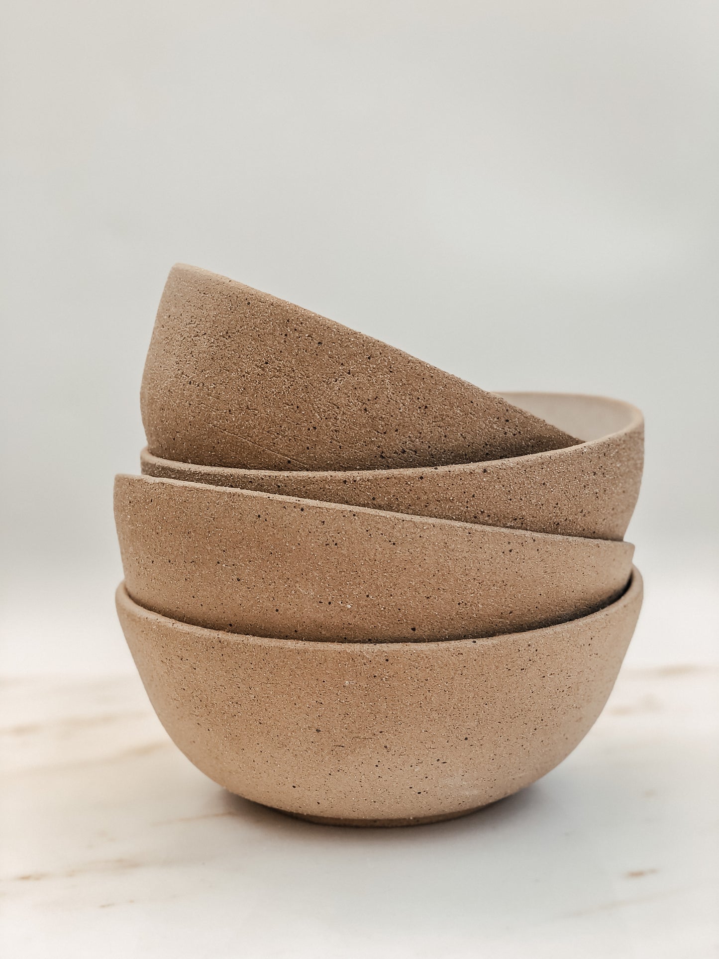Speckled and white ceramic bowl