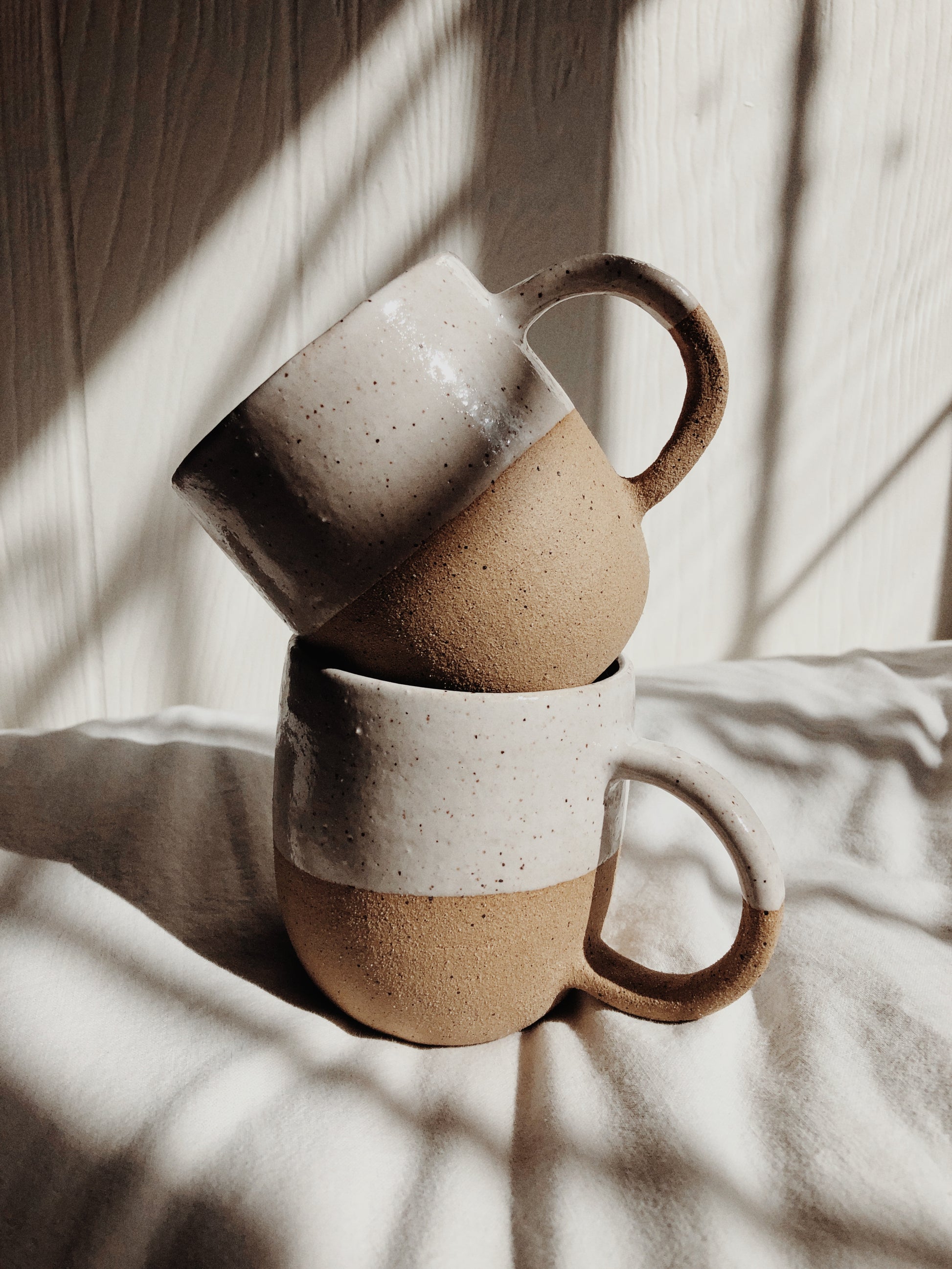 speckled clay and white glaze ceramic mug