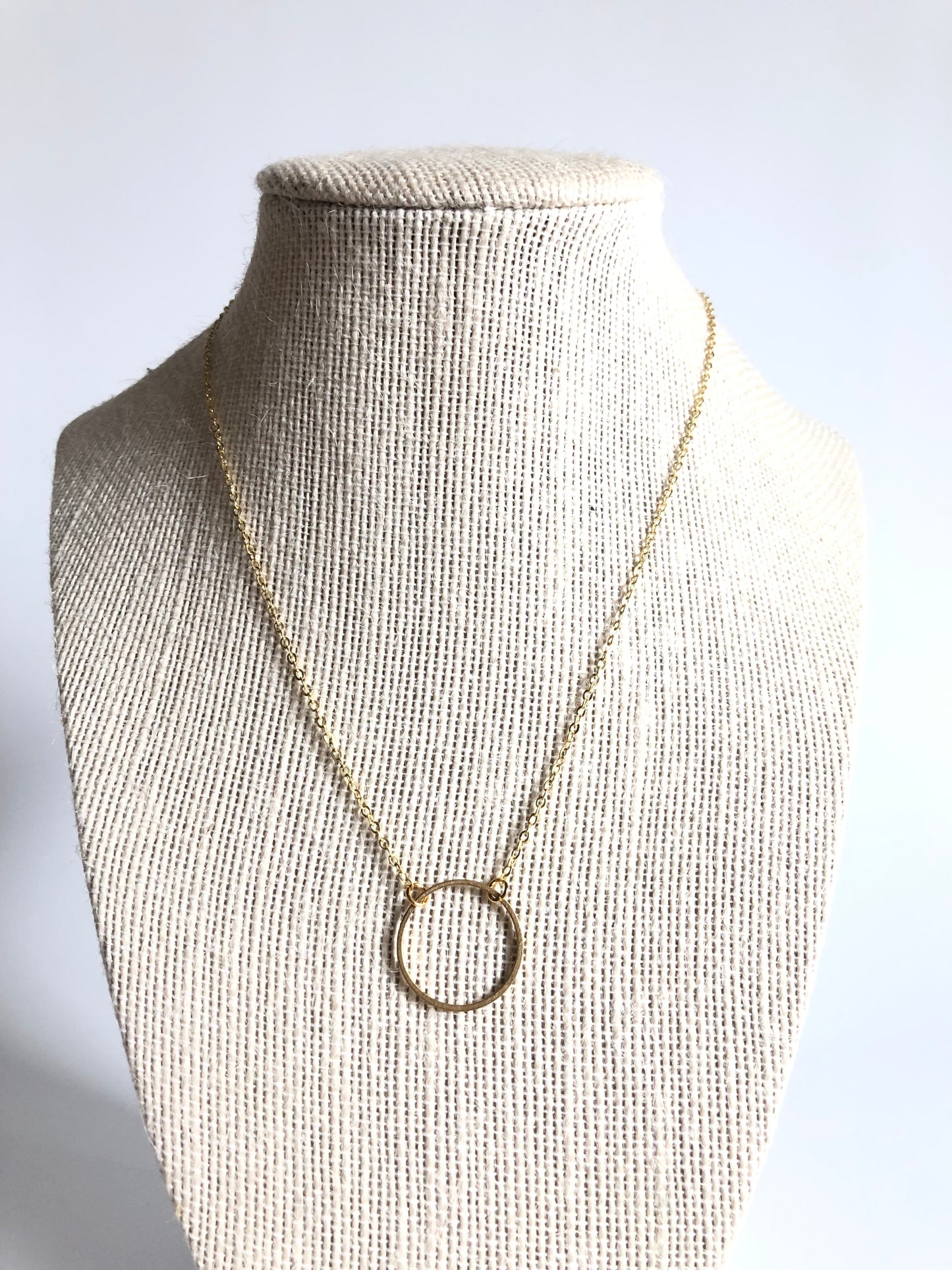 Gold Circle Necklace on a gold chain