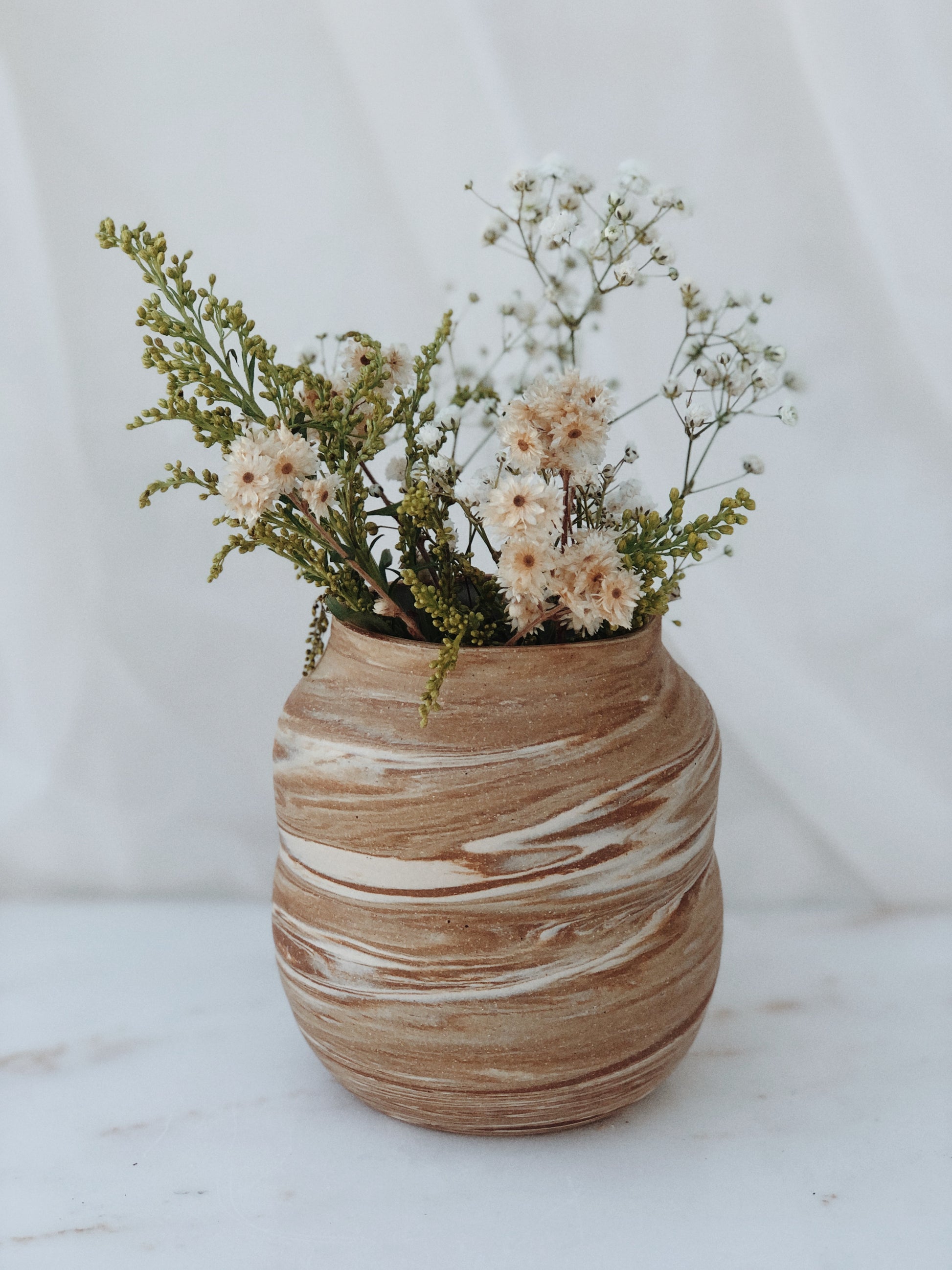 brown and white marble ceramic vase